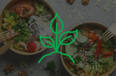 two salads in compostable containers with green leaf icon overlay  two salads in compostable containers with green leaf icon overlay