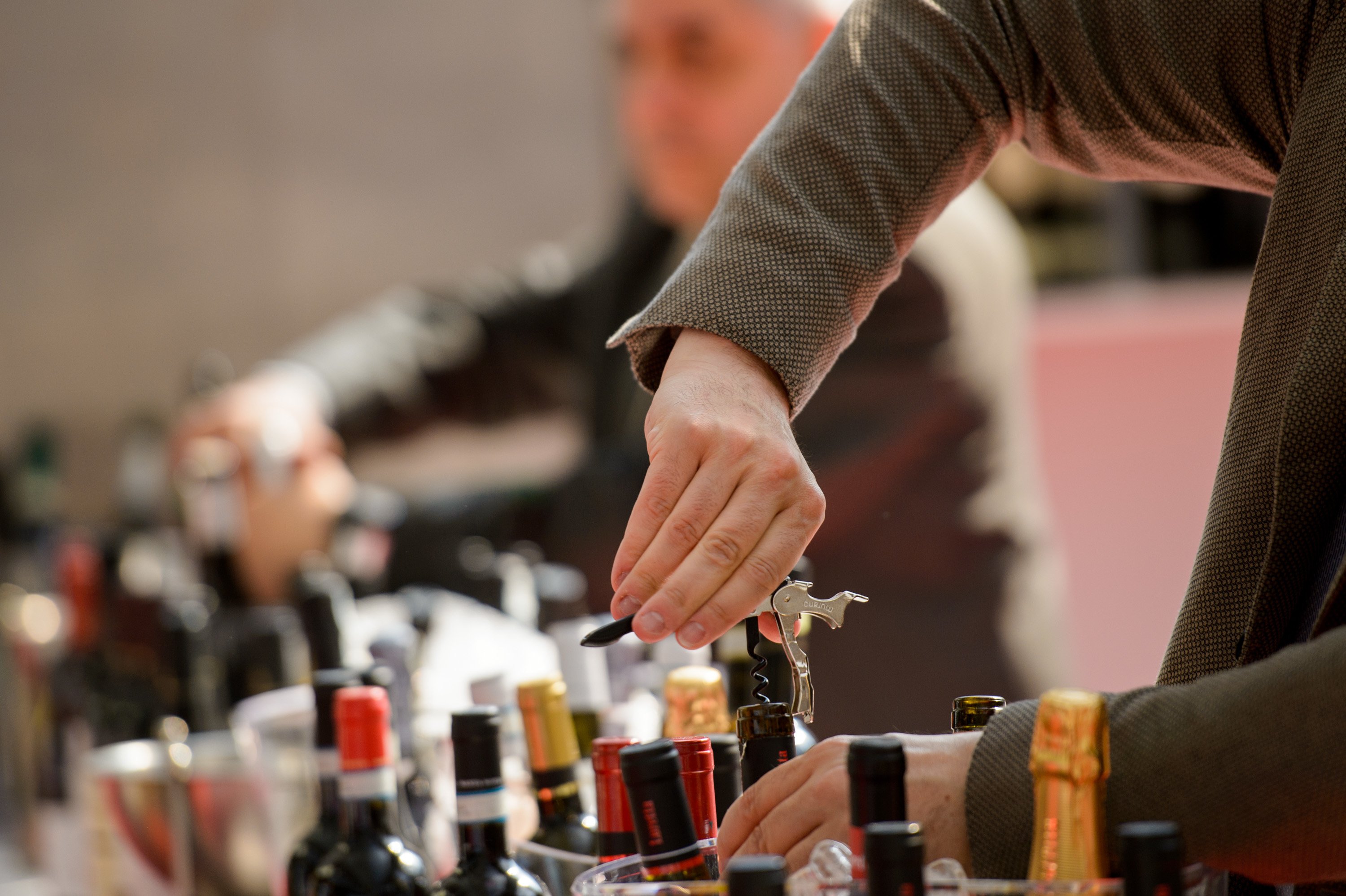 Ehrmanns wine range with man unscrewing a bottle Ehrmanns wine range with man unscrewing a bottle