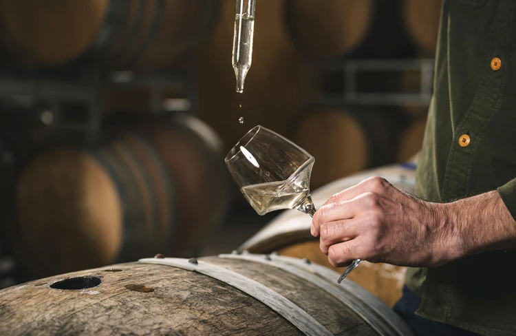 Flint Vineyard wine with a barrell  Flint Vineyard wine with a barrell